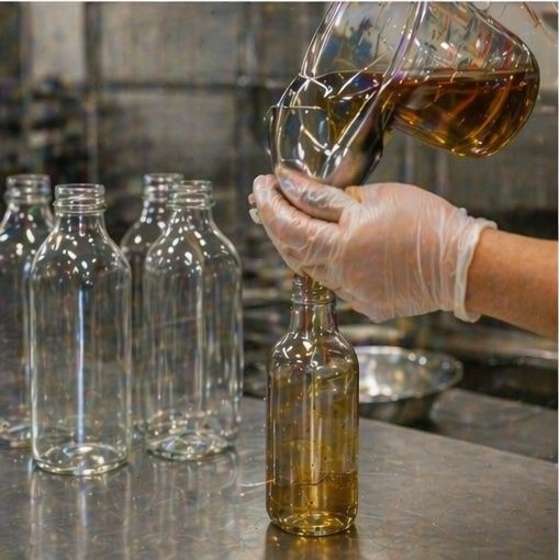 Hand-filling bottles